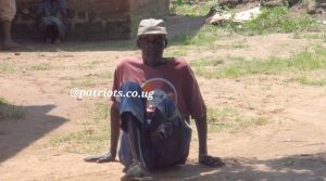 The disabled 75 years old Mzee Andrua Simon who was allegedly deceived by the LC3 Chairperson for Awiziru Sub-county Over His PDM Money. Photo by Osuta Yusuf, Our Reporter.